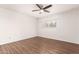 Spacious bedroom featuring neutral walls, wood floors, and ample natural light from a window at 2205 E Linda Ct, Phoenix, AZ 85022