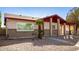 Single-story home showcasing desert landscaping, brick accents, and a covered carport at 2205 E Linda Ct, Phoenix, AZ 85022