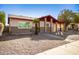 Single-story home showcasing desert landscaping, brick accents, and a covered carport at 2205 E Linda Ct, Phoenix, AZ 85022