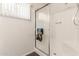 A modern bathroom with a stand-up shower featuring a sliding glass door at 2205 E Linda Ct, Phoenix, AZ 85022