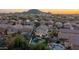 Aerial view of a neighborhood with pools and mountain views at 2226 E Parkside Ln, Phoenix, AZ 85024