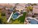 Aerial view of backyard featuring a custom pool, artificial turf, and desert landscaping at 2226 E Parkside Ln, Phoenix, AZ 85024