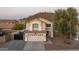 Two-story home with a tile roof, driveway, desert landscaping, and mountain backdrop at 2226 E Parkside Ln, Phoenix, AZ 85024