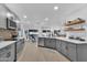 Bright kitchen featuring gray cabinetry, stainless steel appliances, and open layout to dining area at 2226 E Parkside Ln, Phoenix, AZ 85024