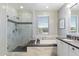 Elegant bathroom featuring a glass-enclosed shower, soaking tub, and dual sink vanity at 23065 N 75Th St, Scottsdale, AZ 85255