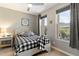 Charming bedroom with natural lighting, patterned bedding, and a nightstand lamp at 23065 N 75Th St, Scottsdale, AZ 85255