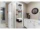 Hallway leading to bedroom with a ceiling fan, dresser, and modern wall decor at 23065 N 75Th St, Scottsdale, AZ 85255