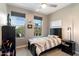 Bedroom with a large window, neutral color palette, and a twin-sized bed at 23065 N 75Th St, Scottsdale, AZ 85255