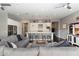 Stylish living room with a kitchen island, a gray sectional, and modern decor at 23065 N 75Th St, Scottsdale, AZ 85255