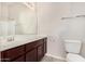 Bright bathroom features a dark vanity, large mirror, and tile flooring at 2402 E 5Th St # 1403, Tempe, AZ 85288