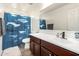 Well-lit bathroom features a whale themed shower curtain and a large vanity at 26312 N 132Nd Ln, Peoria, AZ 85383