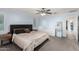 Comfortable bedroom featuring soft blue walls, large windows and mirrored sliding door closet at 26312 N 132Nd Ln, Peoria, AZ 85383