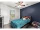 Cozy bedroom featuring a modern color palette, ceiling fan and lots of natural light at 26312 N 132Nd Ln, Peoria, AZ 85383