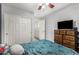 Well lit bedroom featuring a modern color palette and a closet at 26312 N 132Nd Ln, Peoria, AZ 85383