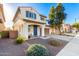 Inviting two-story home with a xeriscaped front yard and a covered entry sitting area at 26312 N 132Nd Ln, Peoria, AZ 85383