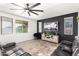 Spacious living room features tile floors, a comfortable sofa, and plenty of natural light at 26312 N 132Nd Ln, Peoria, AZ 85383