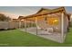 Inviting covered patio featuring outdoor seating and string lights, perfect for relaxation at 3147 E Michigan Ave, Phoenix, AZ 85032