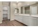 Modern bathroom featuring double sinks, large mirrors, and tile floors at 31541 N Wet Creek Rd, San Tan Valley, AZ 85143