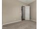 Bedroom featuring neutral carpet, electrical outlets, and an open door at 31541 N Wet Creek Rd, San Tan Valley, AZ 85143