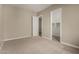 Bedroom with carpet, neutral walls, a closet, and a white door at 31541 N Wet Creek Rd, San Tan Valley, AZ 85143