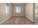 Neutral-toned living room featuring tile floors, large windows, and ample natural light at 31541 N Wet Creek Rd, San Tan Valley, AZ 85143