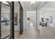 Bright and airy foyer showcasing herringbone floors, modern design, and an open floor plan at 3539 E Starflower Dr, Queen Creek, AZ 85142