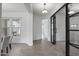 Bright hallway with tile floors and doors with glass panels at 3539 E Starflower Dr, Queen Creek, AZ 85142