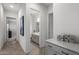 Bright hallway featuring a herringbone floor, access to rooms and bathroom with patterned tile at 3539 E Starflower Dr, Queen Creek, AZ 85142