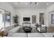 Bright and airy living room with modern furnishings, media center, and neutral decor at 3539 E Starflower Dr, Queen Creek, AZ 85142