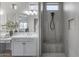 Bright bathroom featuring a double vanity, quartz counters, tiled floor, and tiled shower at 3539 E Starflower Dr, Queen Creek, AZ 85142