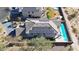 Aerial view of a house with solar panels and a sparkling blue pool at 3553 N 292Nd Dr, Buckeye, AZ 85396