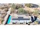 Aerial view of a lovely home with a pristine pool and eco-friendly solar panels at 3553 N 292Nd Dr, Buckeye, AZ 85396