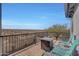 Relaxing balcony featuring a cozy fire table, comfortable chairs, and stunning desert views at 3553 N 292Nd Dr, Buckeye, AZ 85396