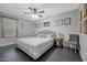 Bedroom features a neutral color palette, a large bed, a ceiling fan, and modern decor at 3553 N 292Nd Dr, Buckeye, AZ 85396