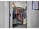 Walk-in closet with built-in shelving and well-organized storage for clothes, hats, and accessories at 3553 N 292Nd Dr, Buckeye, AZ 85396