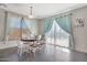 A dining area is filled with natural light from sliding glass doors to the outdoor pool area at 3553 N 292Nd Dr, Buckeye, AZ 85396