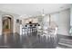 Bright dining area featuring sleek, dark floors and counter seating for modern living at 3553 N 292Nd Dr, Buckeye, AZ 85396