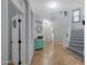 Welcoming foyer with tile floors, staircase with decorative risers, and bright, neutral walls at 3553 N 292Nd Dr, Buckeye, AZ 85396