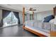 Main bedroom featuring a four-poster bed, deck access, and generous natural light at 3553 N 292Nd Dr, Buckeye, AZ 85396