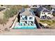 Back exterior of the house showcasing the backyard pool and second-story balcony at 3553 N 292Nd Dr, Buckeye, AZ 85396