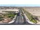 Landscaped street leading to the community, lined with desert vegetation and palm trees at 3553 N 292Nd Dr, Buckeye, AZ 85396