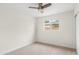 This bright bedroom features a window letting in natural light and neutral carpeting at 3718 E Sheridan St, Phoenix, AZ 85008