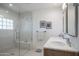 Modern bathroom with a glass-enclosed shower featuring a built-in bench and dual sinks at 37206 N Tom Darlington Dr # 13, Carefree, AZ 85377