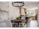 Stylish dining area adjacent to a modern kitchen, featuring a round table and comfortable seating at 37206 N Tom Darlington Dr # 13, Carefree, AZ 85377