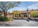 Charming single-story home with a tile roof and a well-manicured yard, creating an inviting curb appeal at 37206 N Tom Darlington Dr # 13, Carefree, AZ 85377