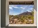 Framed landscape view from the home's window, capturing the natural beauty of the area at 37206 N Tom Darlington Dr # 13, Carefree, AZ 85377