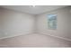 Bedroom with neutral walls and carpet, and natural light from a window at 3911 S 79Th Ln, Phoenix, AZ 85043