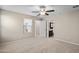 Bedroom with neutral carpet flooring, ceiling fan, and bright window at 3911 S 79Th Ln, Phoenix, AZ 85043