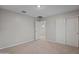 Bedroom with neutral walls and carpet, closet, and paneled door at 3911 S 79Th Ln, Phoenix, AZ 85043