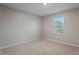 Bedroom with neutral walls and carpet, and natural light from a window at 3911 S 79Th Ln, Phoenix, AZ 85043